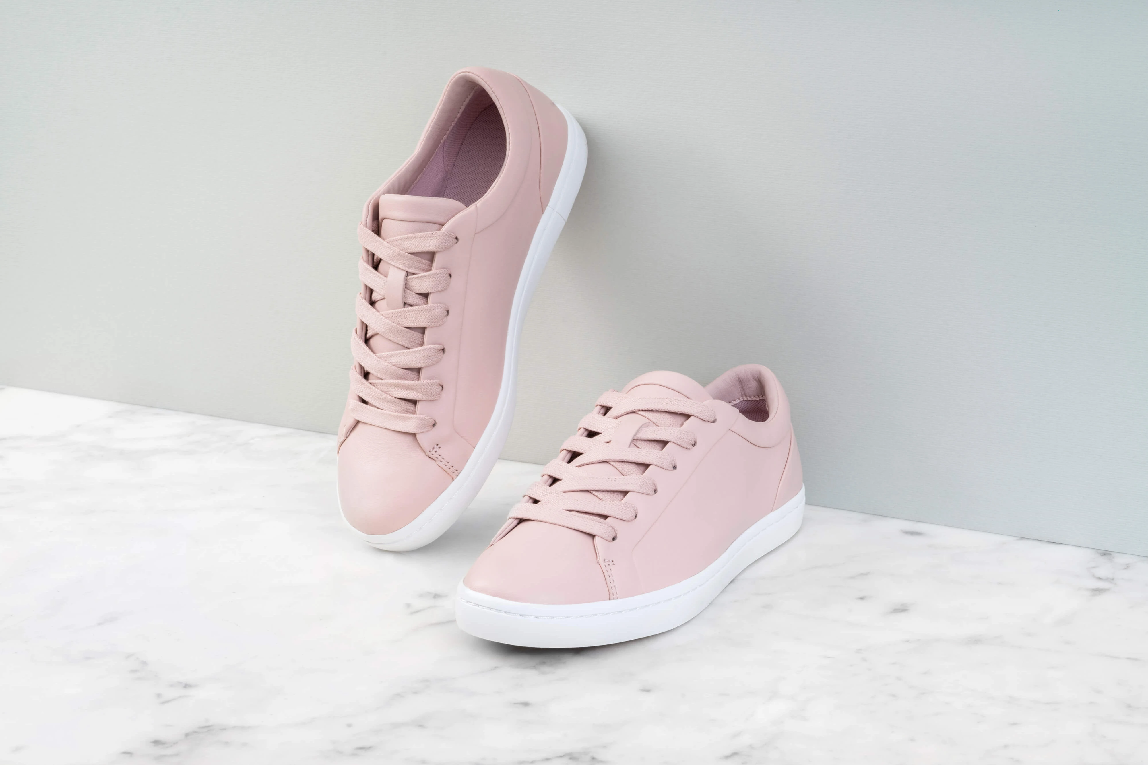 Basi Group cover image: pale pink sneakers on marble